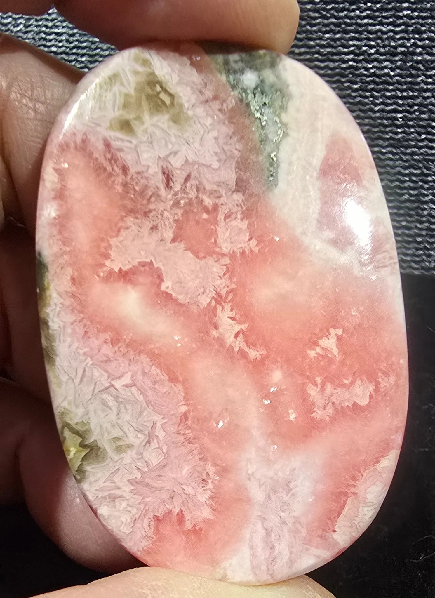 Rhodochrosite Palm Stone specimen