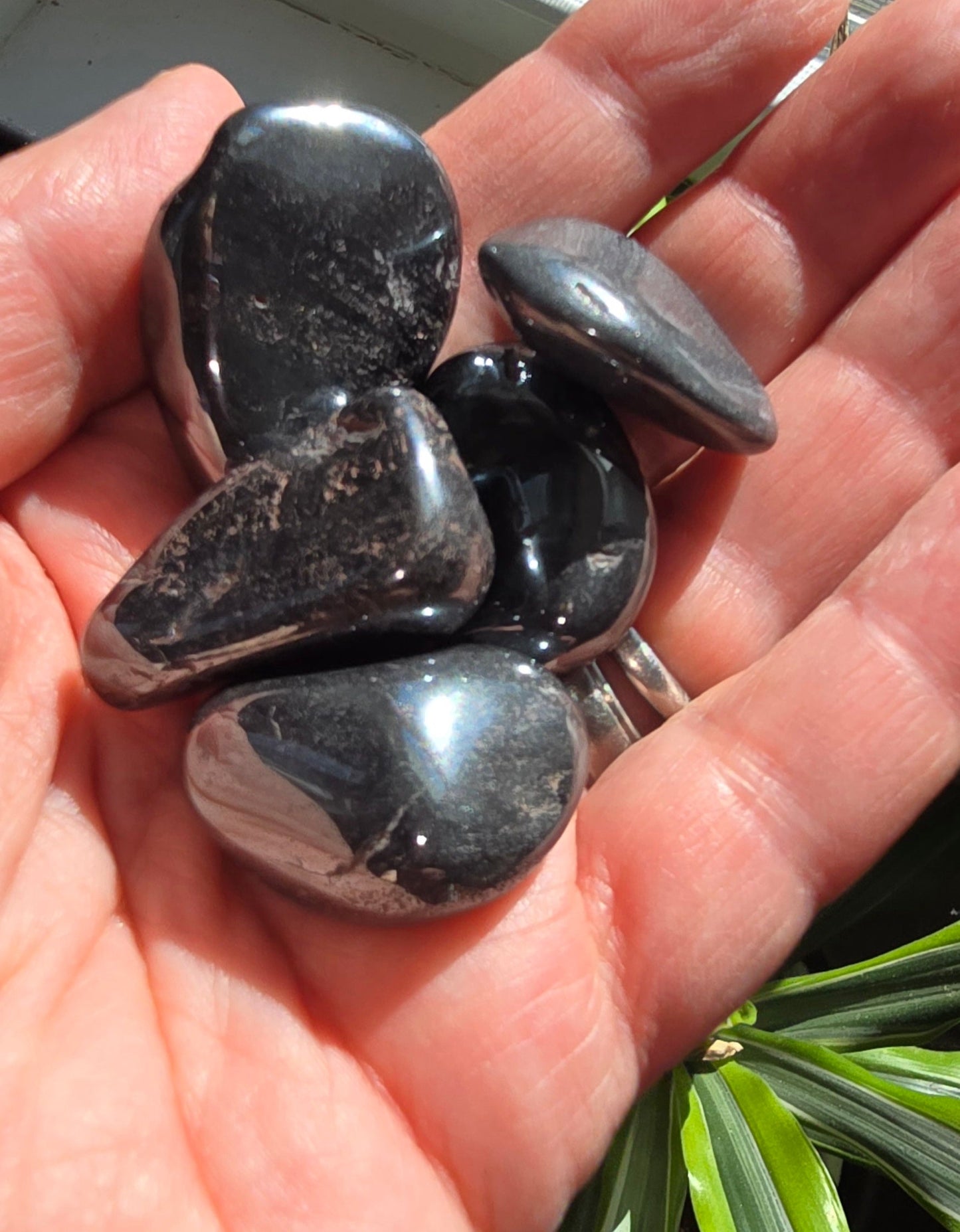 Hematite tumble stone with metallic gray polished smooth surface