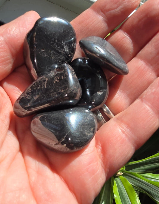 Hematite tumble stone with metallic gray polished smooth surface