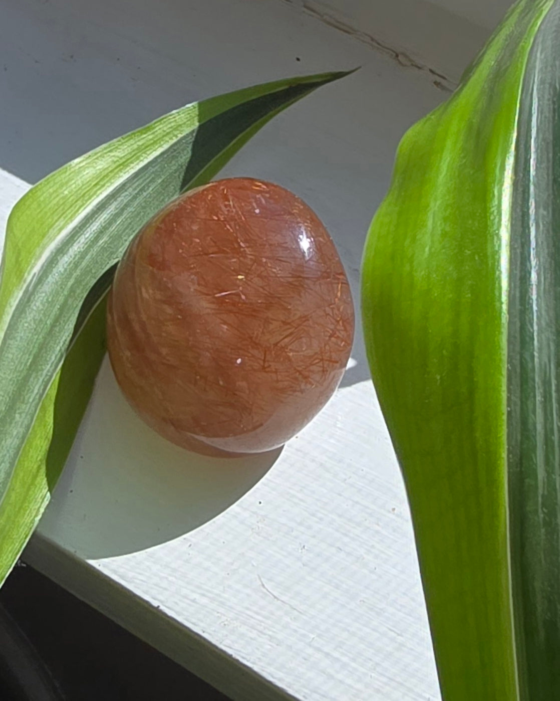 Copper rutilated quartz polished lens from Brazil with copper needle inclusions in clear quartz