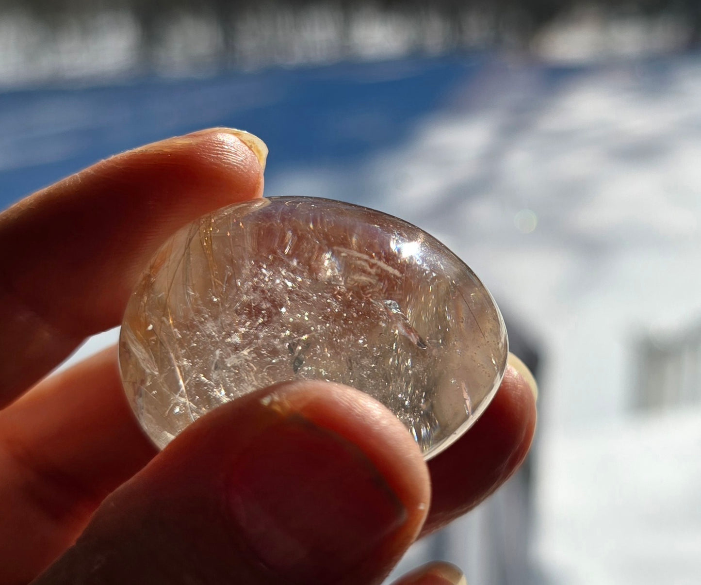 Close-up of Gold Rutilated Quartz Lens with rutile strands